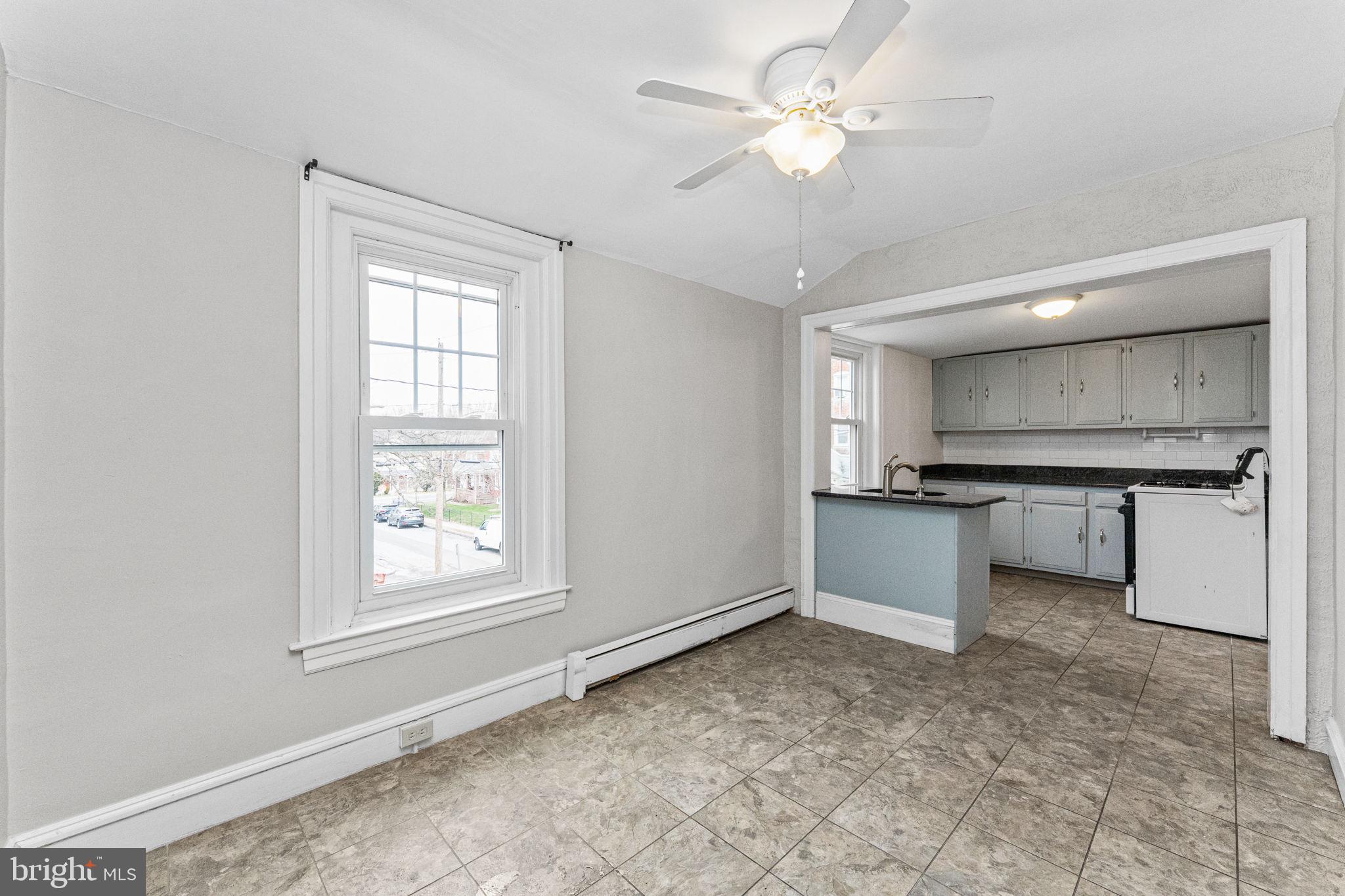 255 Noble Street, Unit B Souderton, PA 18964 - Photo 3 of 15 a view of kitchen with granite countertop cabinets and window