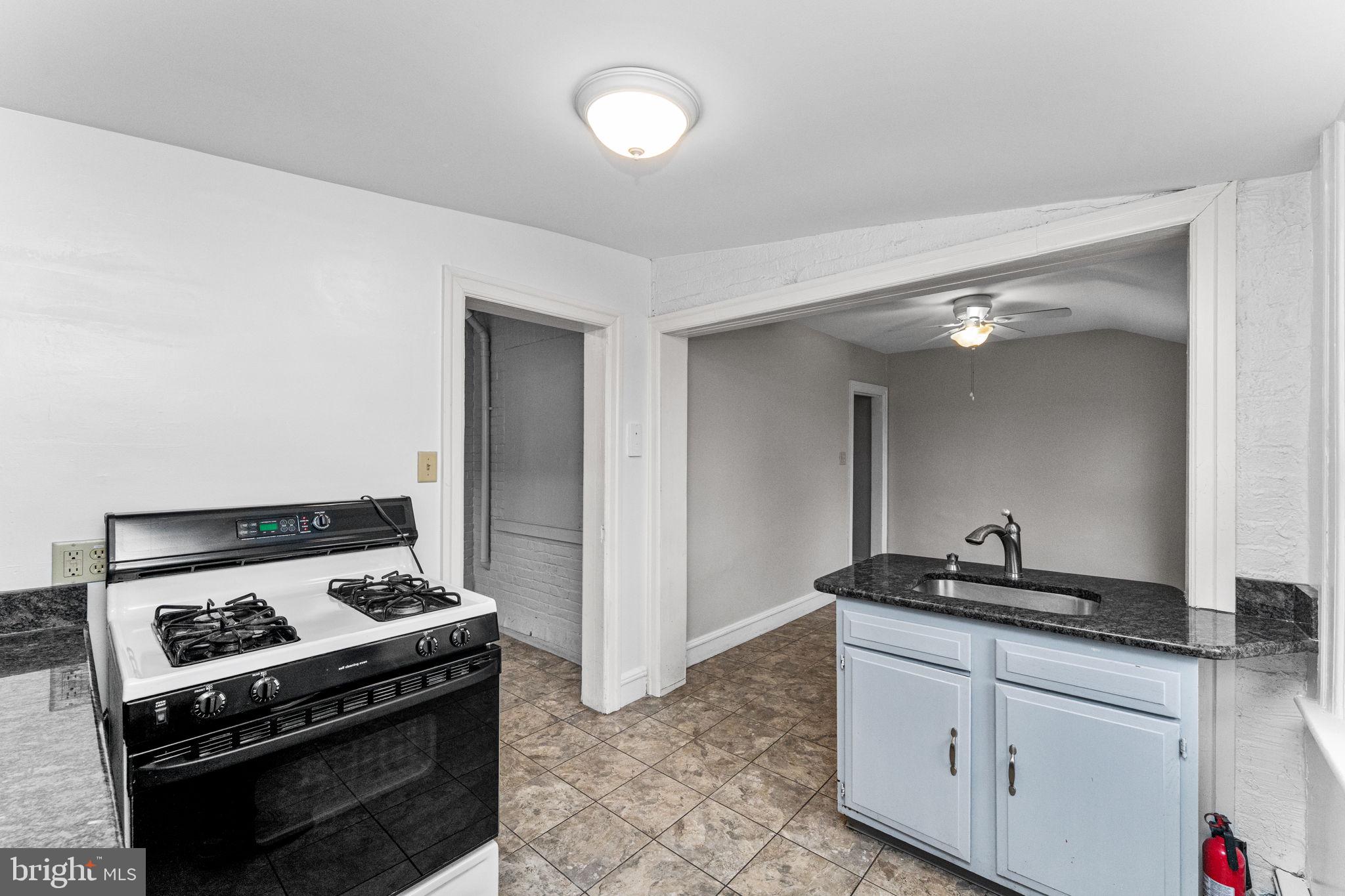 255 Noble Street, Unit B Souderton, PA 18964 - Photo 5 of 15 a kitchen with a stove and a sink
