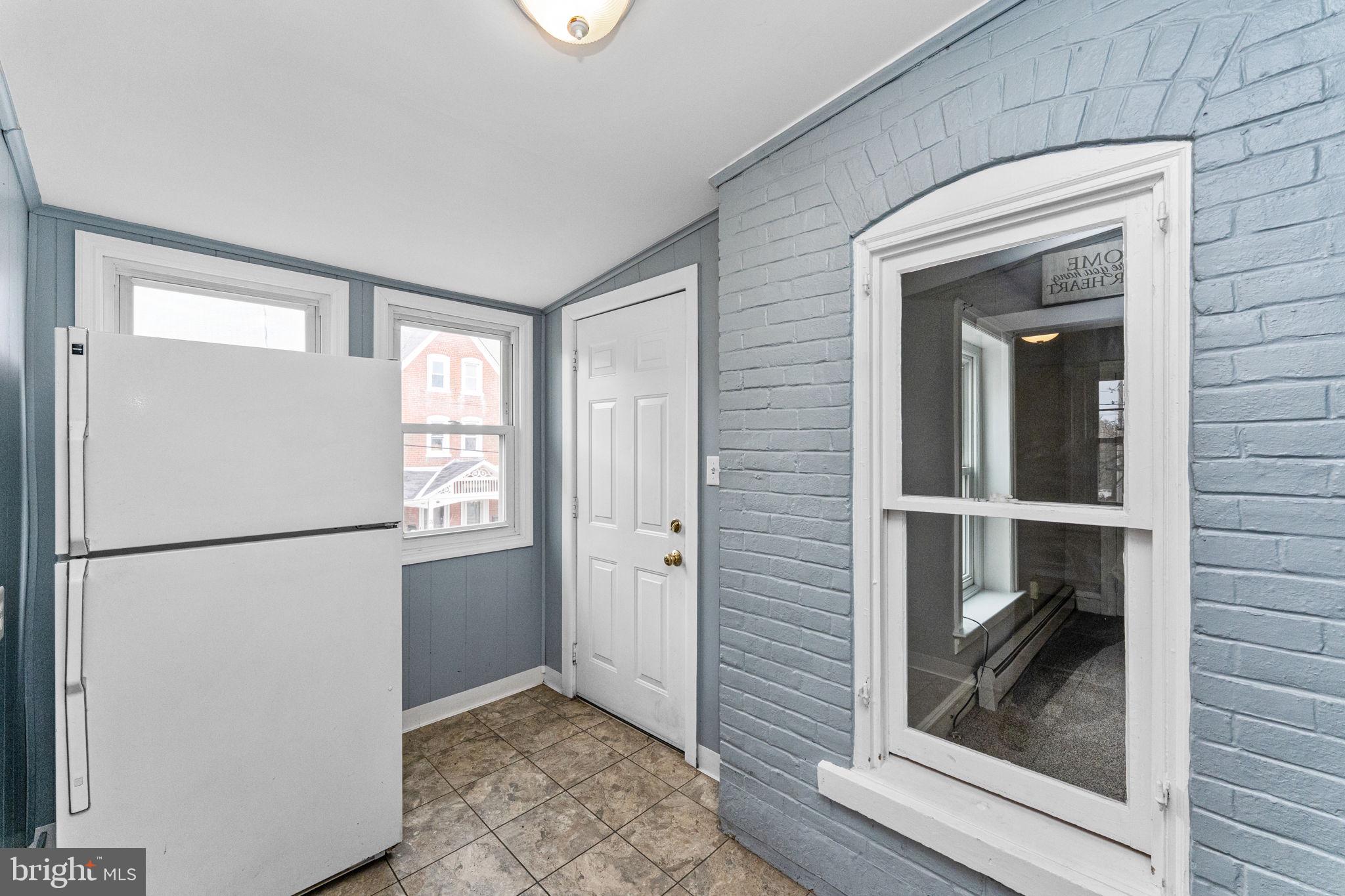 255 Noble Street, Unit B Souderton, PA 18964 - Photo 6 of 15 a view of walk in closet with window and refrigerator