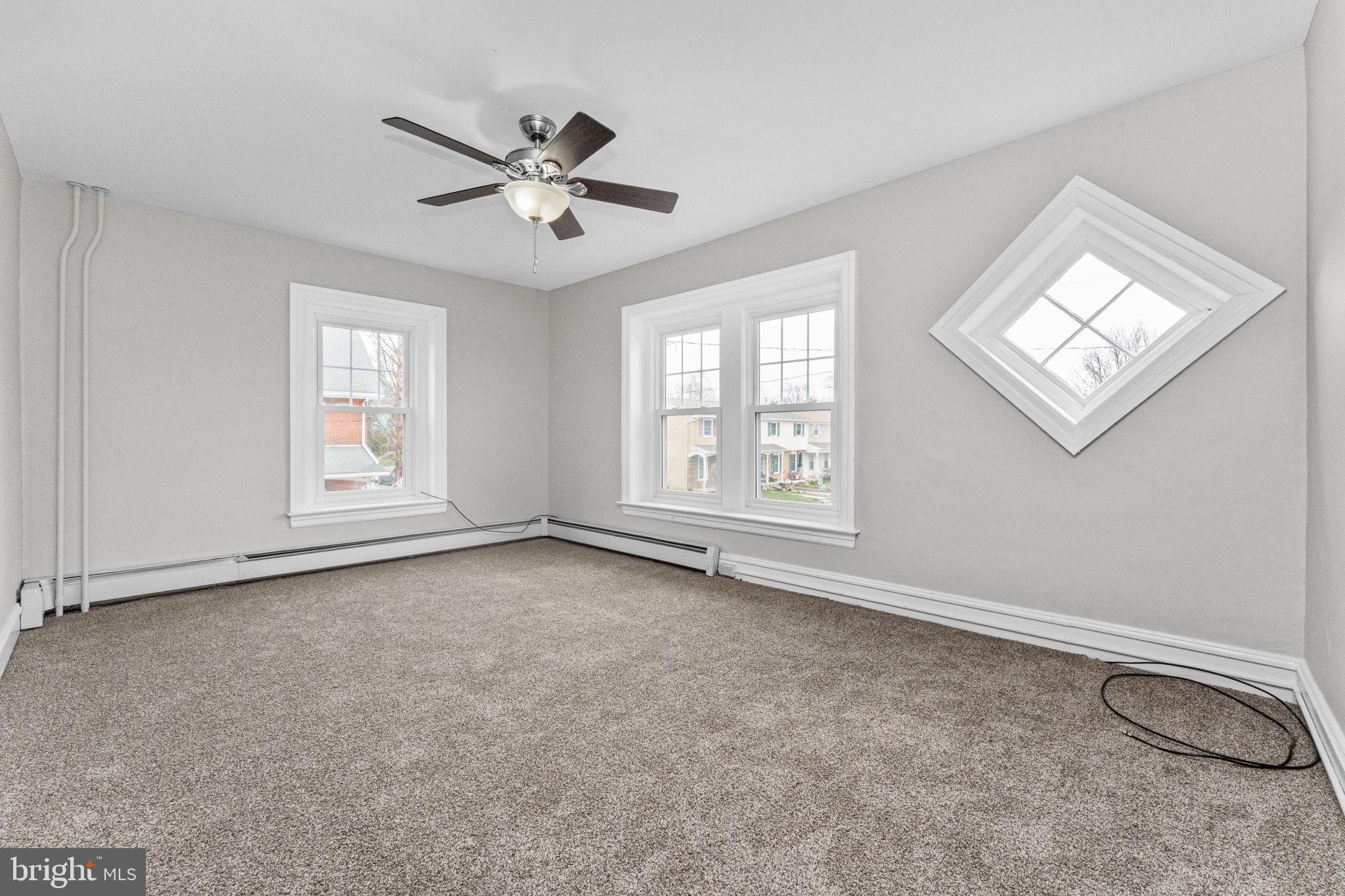 255 Noble Street, Unit B Souderton, PA 18964 - Photo 7 of 15 a view of an empty room with a window
