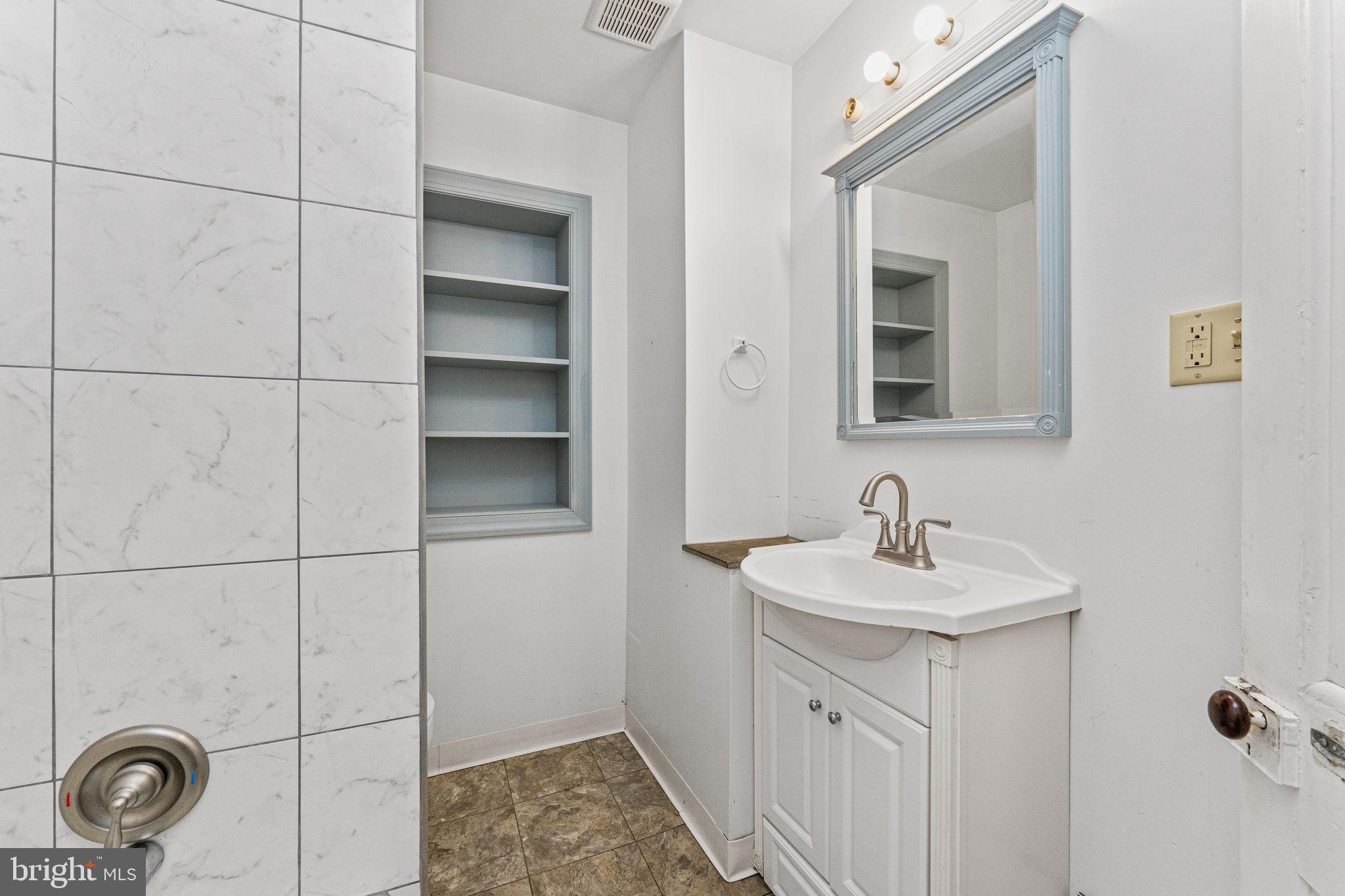 255 Noble Street, Unit B Souderton, PA 18964 - Photo 10 of 15 a bathroom with a sink toilet and vanity