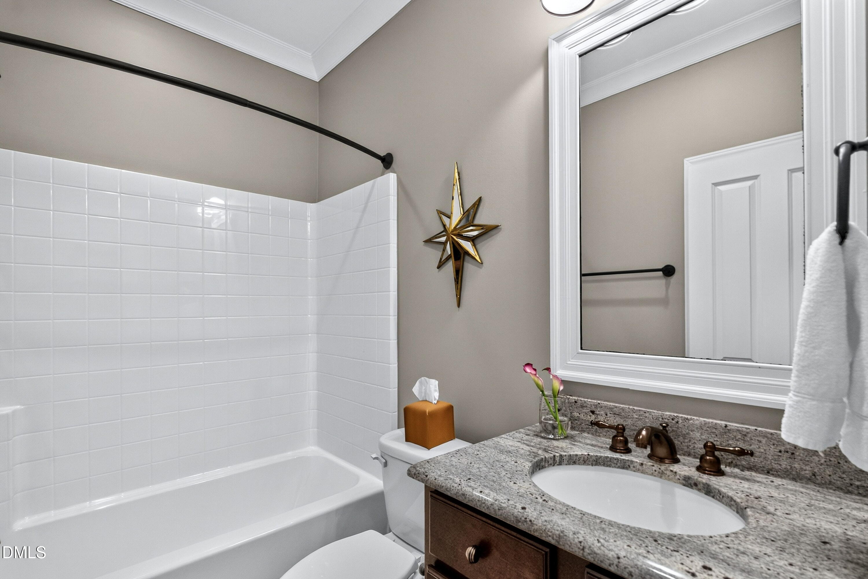 2745 Oberlin Road, Unit 103 Raleigh, NC 27608 - Photo 17 of 23 a bathroom with a granite countertop sink and a mirror