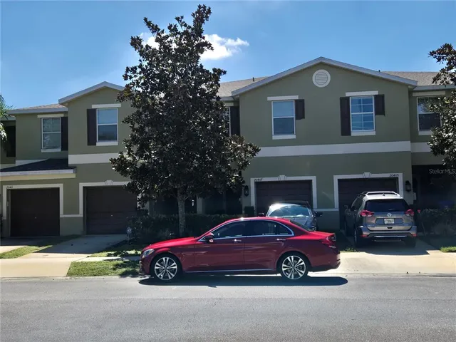 a front view of a house with parking space