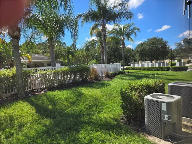 a kitchen with granite countertop a sink cabinets and stainless steel appliances