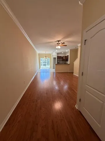 a view of room with wooden floor