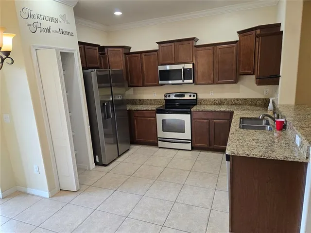 a room with wooden floor and cabinets