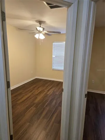 a kitchen that has a lot of cabinets and stainless steel appliances