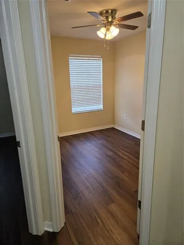 a view of a lake with a house in the background