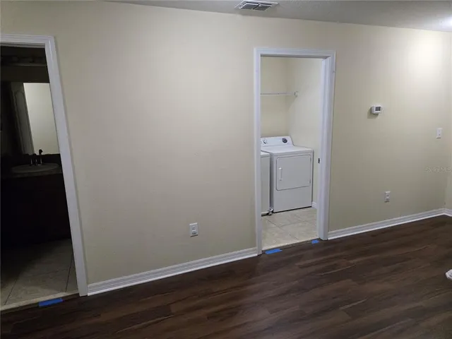 a view of a glass door with a yard from a window