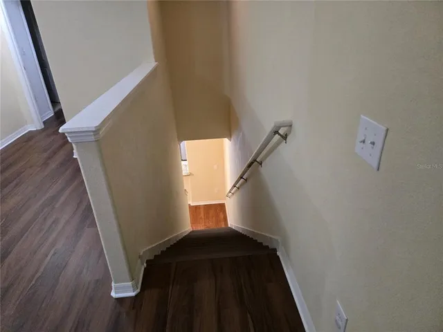 a kitchen with stainless steel appliances granite countertop a refrigerator stove and microwave