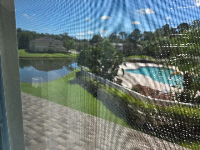 a view of a garden with a fountain