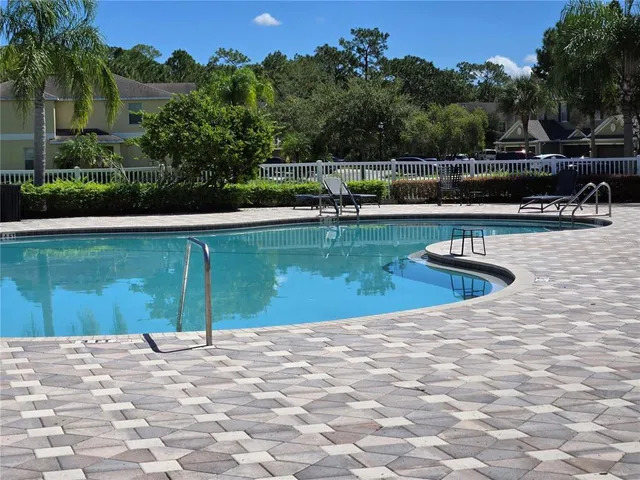 a garden with trees in front of it