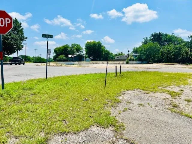 a swimming pool with lots of green space and palm trees
