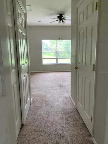 wooden floor in an empty room with a mirror