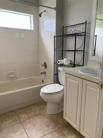 a bathroom with a toilet a sink and bathtub