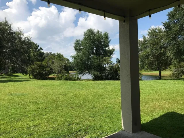 a view of outdoor space with deck and yard