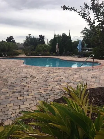 a view of a lake with houses in the back