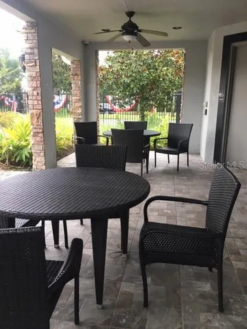 a view of a dining room with furniture window and outside view
