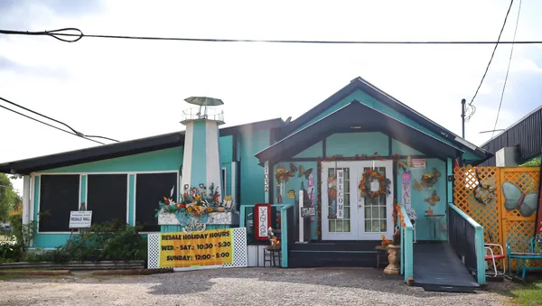 a front view of a house with garage