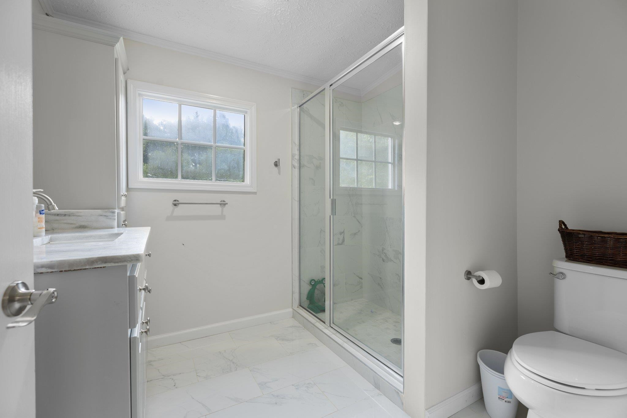 8148 Brooks Road Kenly, NC 27542 - Photo 20 of 38 a bathroom with a granite countertop sink toilet and shower