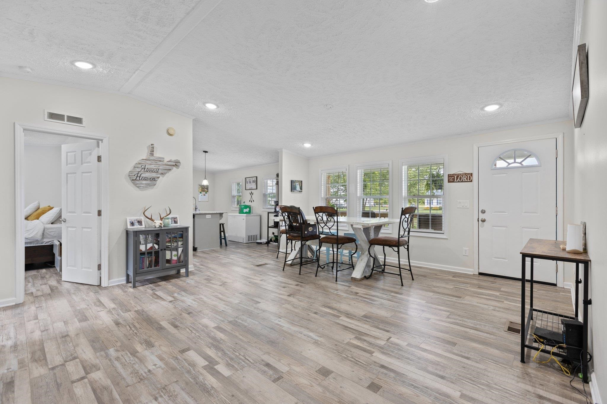 8148 Brooks Road Kenly, NC 27542 - Photo 2 of 38 a living room with furniture and a wooden floor