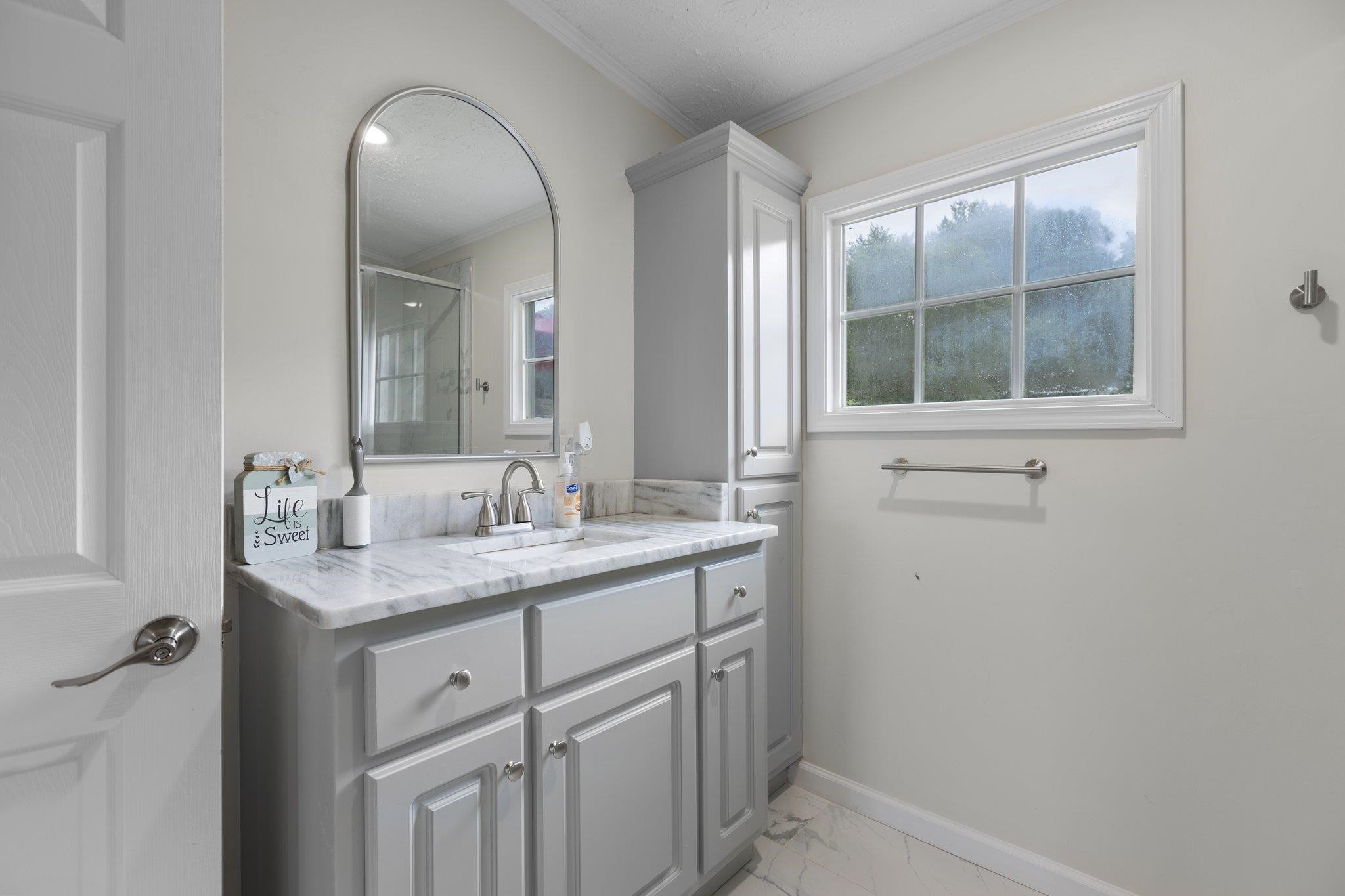 8148 Brooks Road Kenly, NC 27542 - Photo 21 of 38 a bathroom with a granite countertop sink a mirror and a vanity