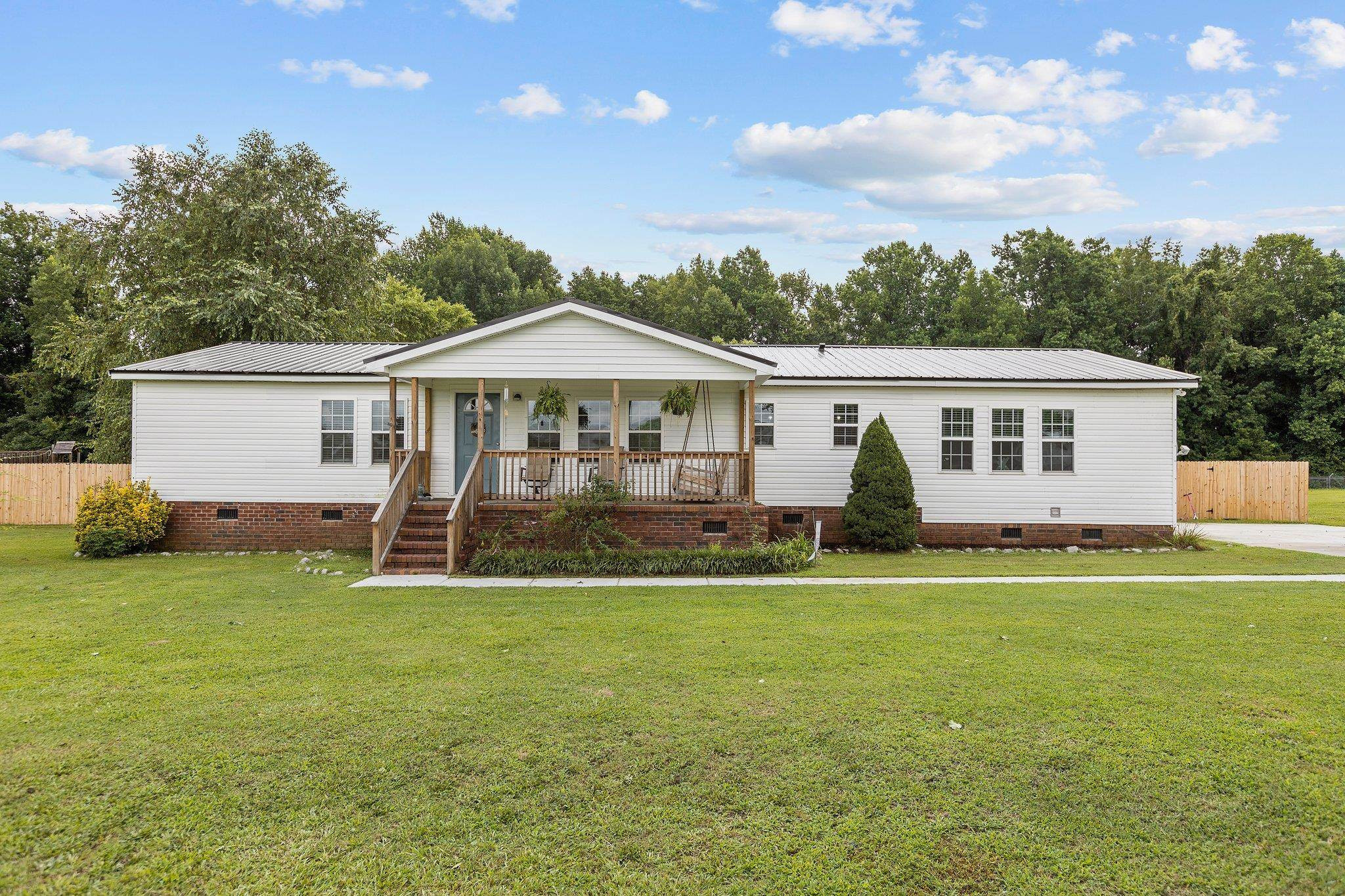 8148 Brooks Road Kenly, NC 27542 - Photo 29 of 38 a front view of a house with a yard