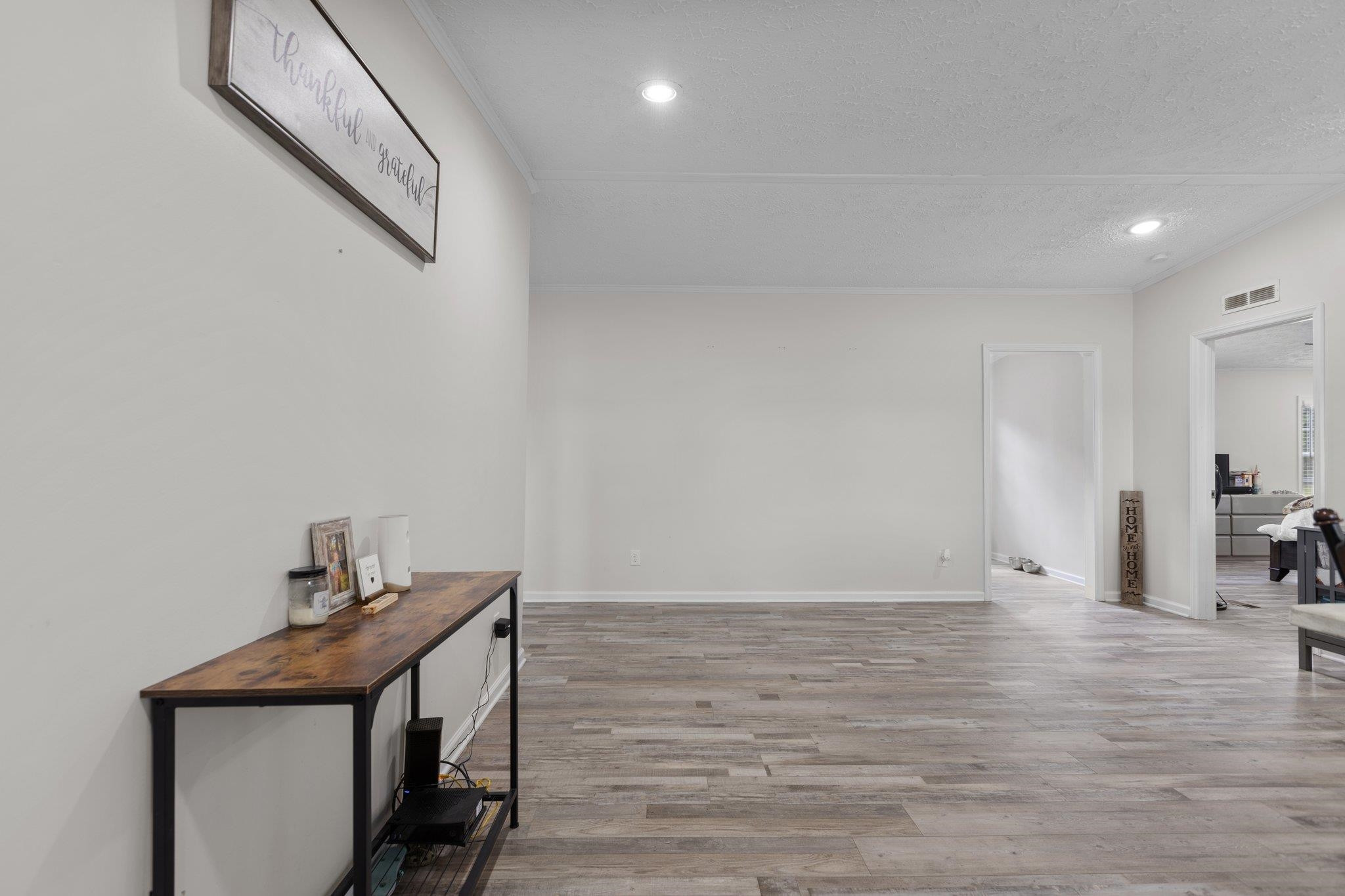 8148 Brooks Road Kenly, NC 27542 - Photo 3 of 38 a view of empty room with wooden floor