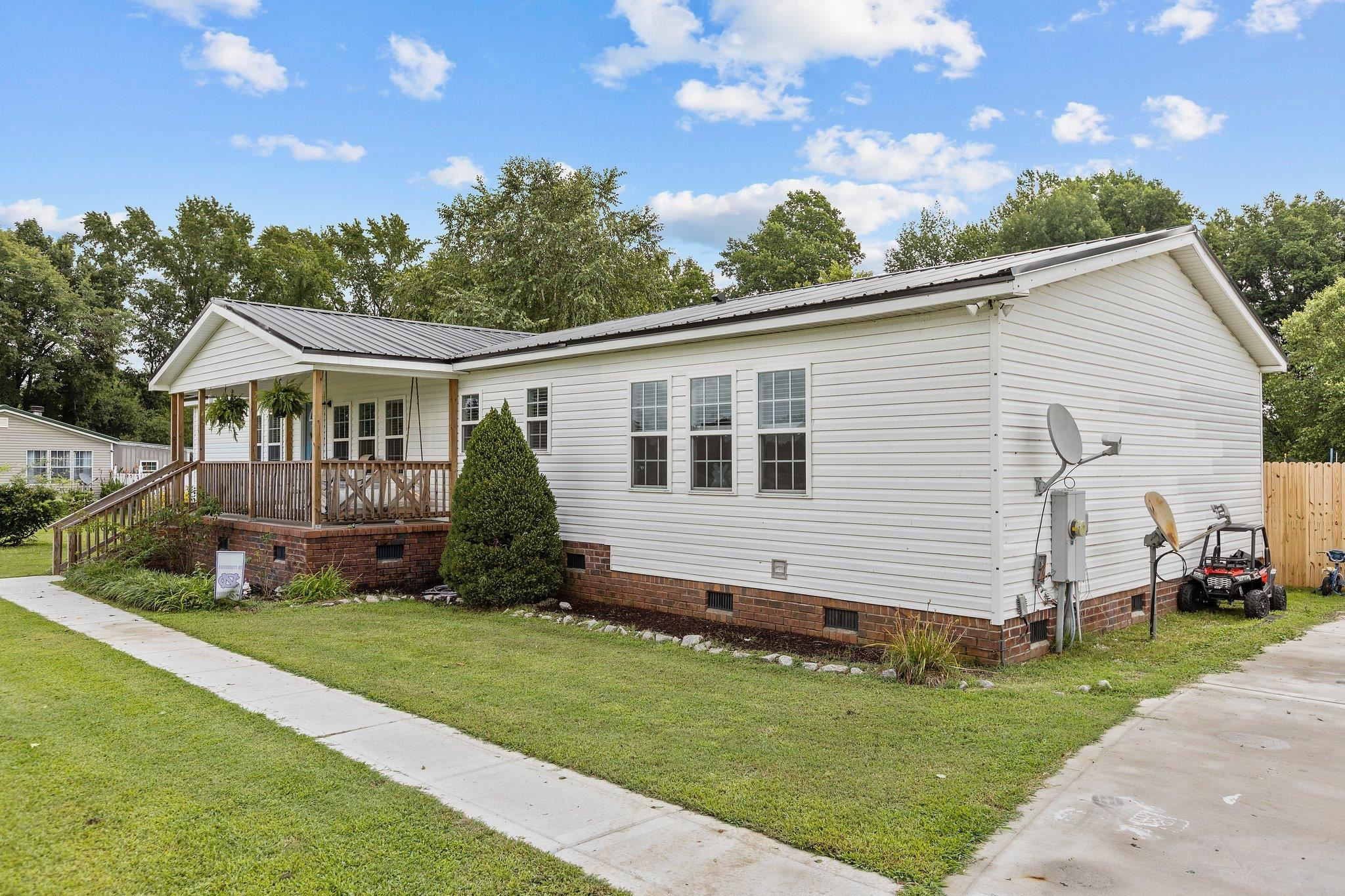 8148 Brooks Road Kenly, NC 27542 - Photo 33 of 38 a view of a house with a yard
