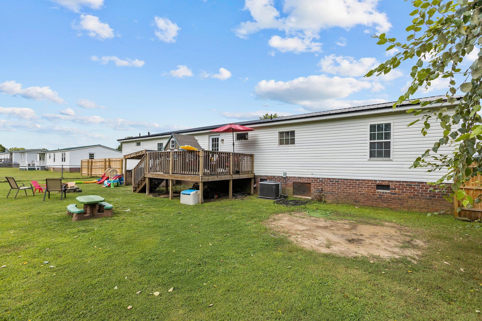 8148 Brooks Road Kenly, NC 27542 - Photo 34 of 38 a view of a house with a yard