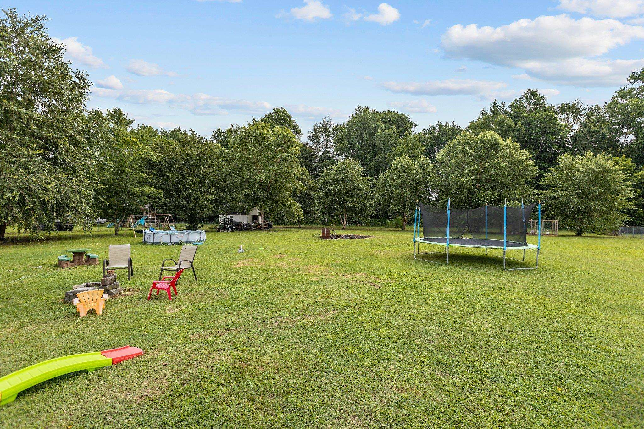 8148 Brooks Road Kenly, NC 27542 - Photo 38 of 38 a view of a golf course with a lake