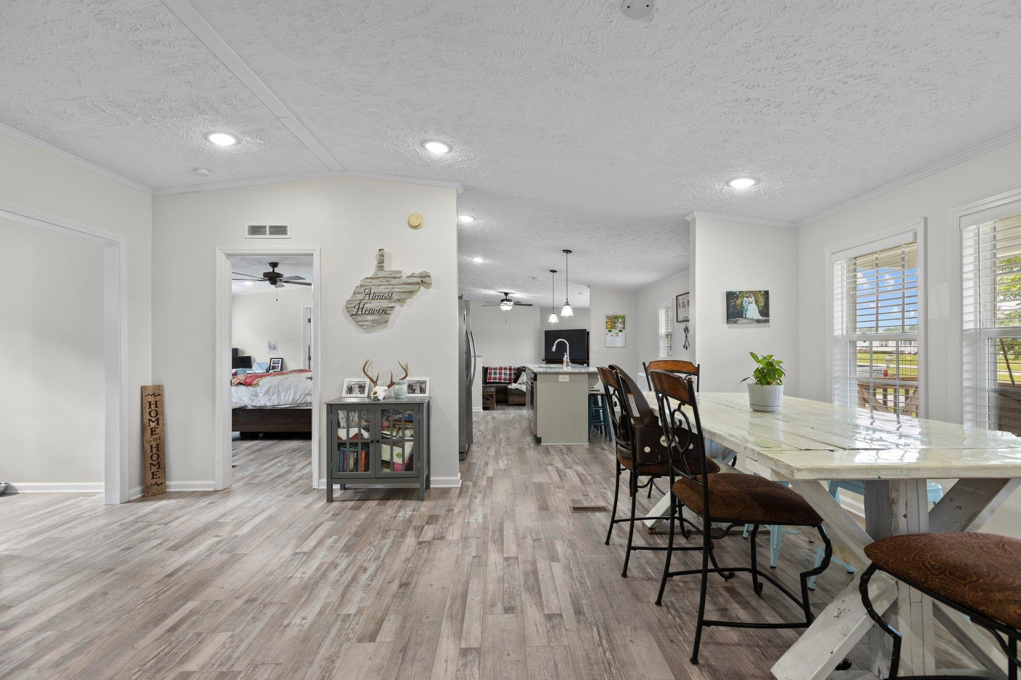 8148 Brooks Road Kenly, NC 27542 - Photo 6 of 38 a view of a a dining room with furniture window and wooden floor