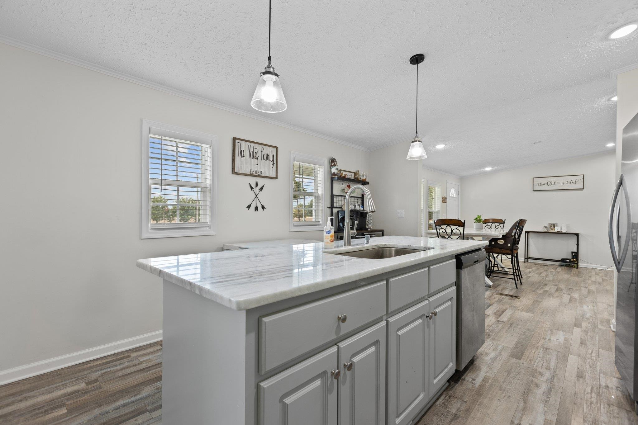 8148 Brooks Road Kenly, NC 27542 - Photo 8 of 38 a kitchen with sink stove and center island