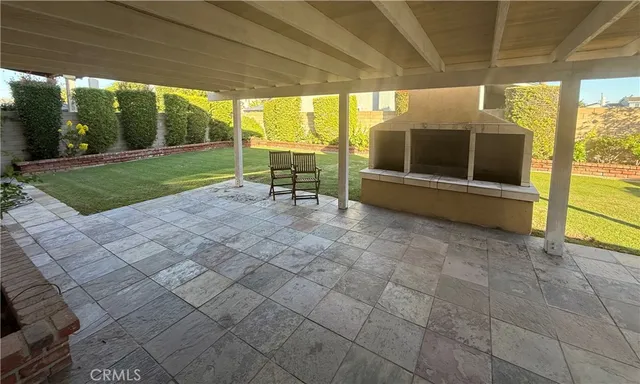a view of a porch with furniture and garden