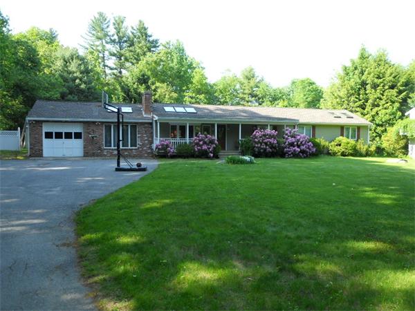 15 Laurel Road Bolton, MA 01740 - Photo 1 of 21 a front view of house with yard and green space