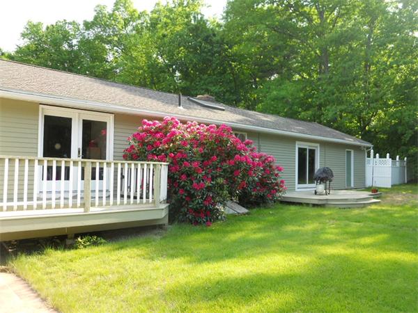 15 Laurel Road Bolton, MA 01740 - Photo 18 of 21 a view of a house with a yard porch and furniture