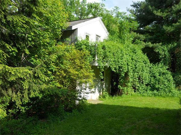 15 Laurel Road Bolton, MA 01740 - Photo 19 of 21 a backyard of a house with lots of green space