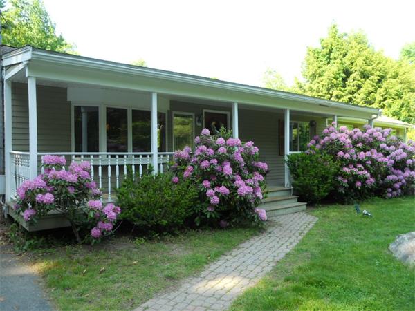 15 Laurel Road Bolton, MA 01740 - Photo 2 of 21 front view of a house with a yard