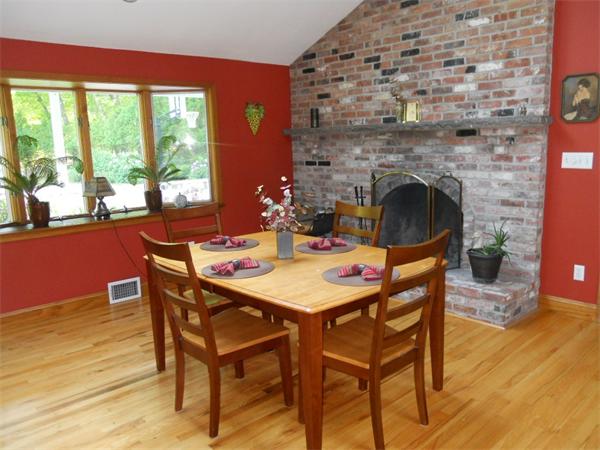 15 Laurel Road Bolton, MA 01740 - Photo 4 of 21 a dining room with furniture and wooden floor