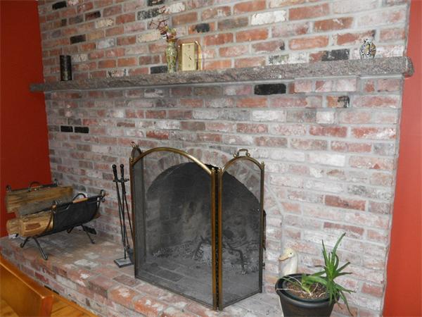 15 Laurel Road Bolton, MA 01740 - Photo 5 of 21 a close view of a fireplace