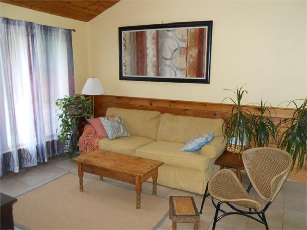 15 Laurel Road Bolton, MA 01740 - Photo 8 of 21 a living room with furniture and a painting on the wall