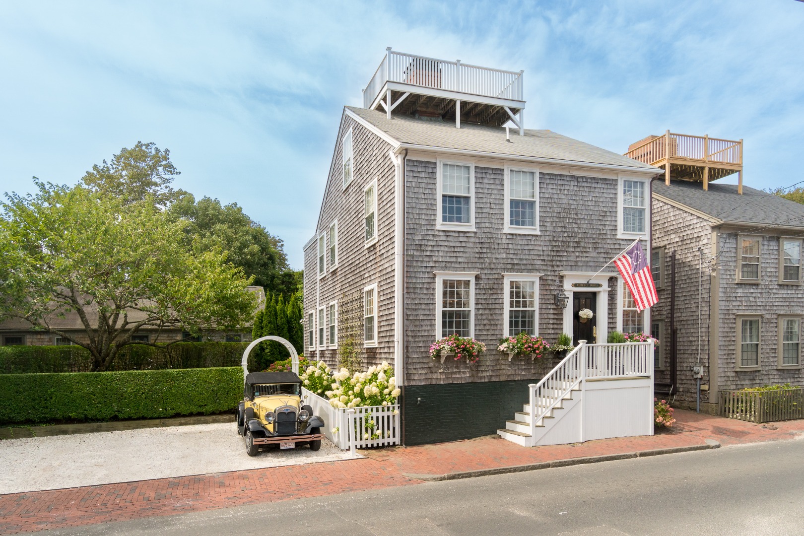 37 Union Street Nantucket, MA 02554 - Photo 2 of 25 a front view of a house with a yard