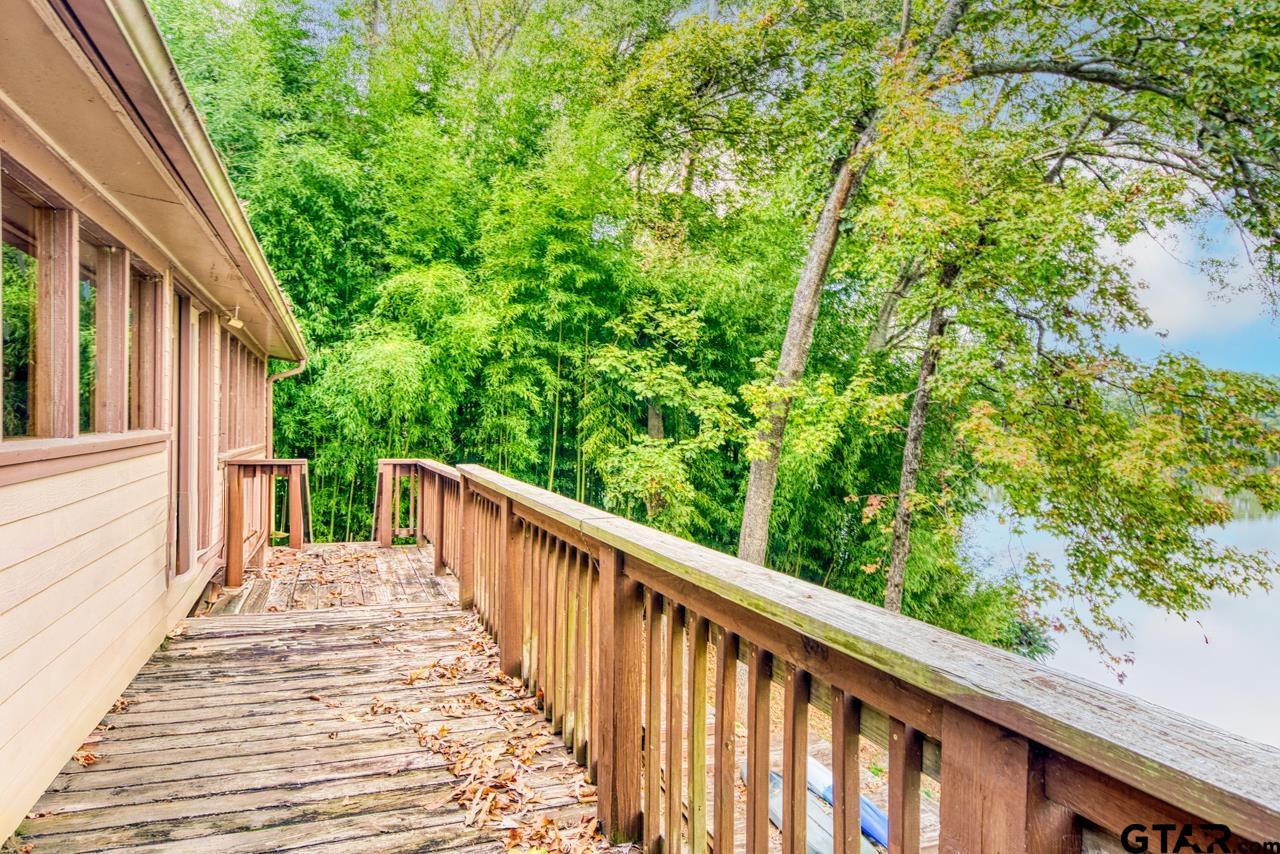 14525 Lake Road West Tyler, TX 75709 - Photo 17 of 30 a view of a wooden floor and trees in front of a window