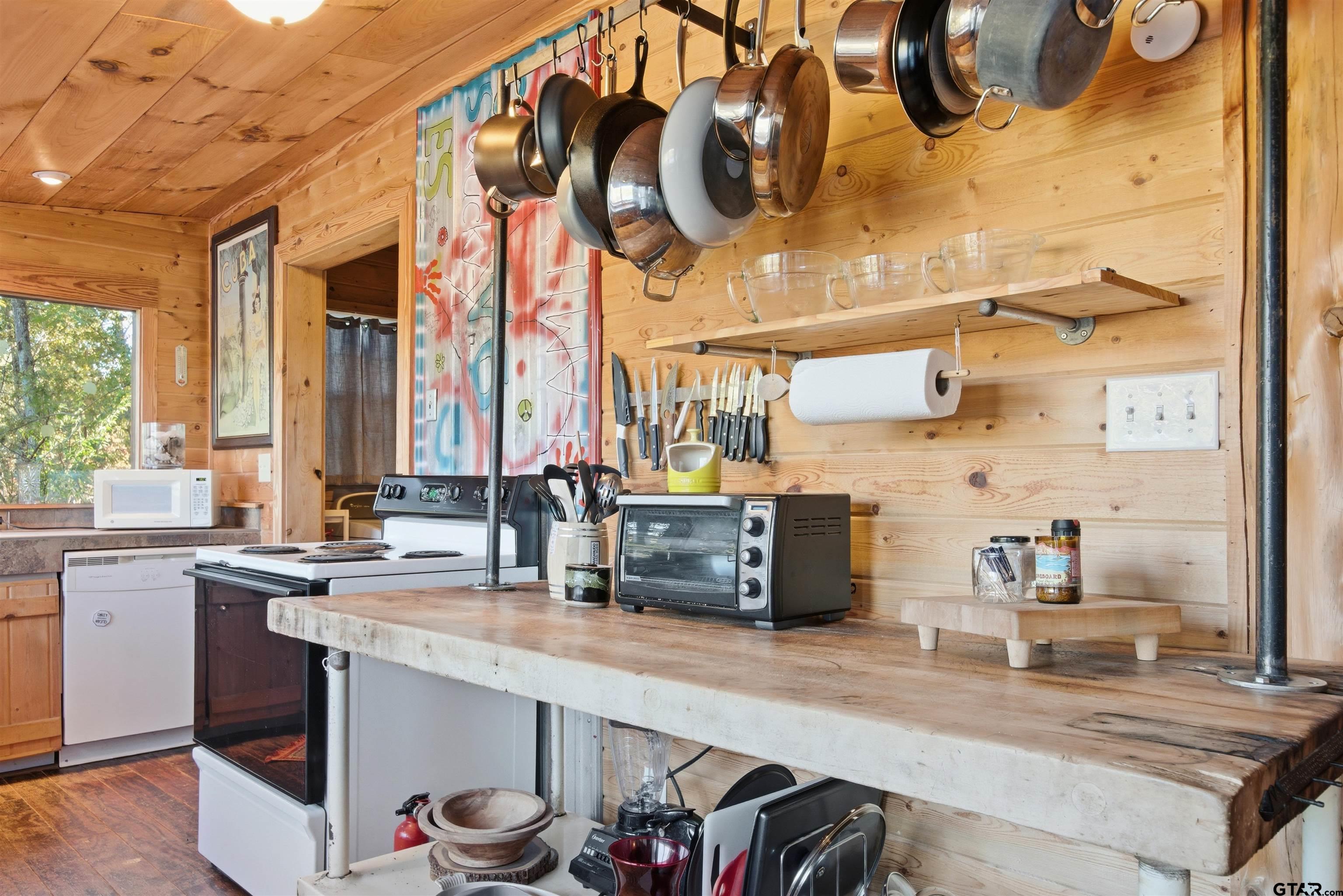 14525 Lake Road West Tyler, TX 75709 - Photo 27 of 30 a kitchen with stainless steel appliances granite countertop a sink and a stove