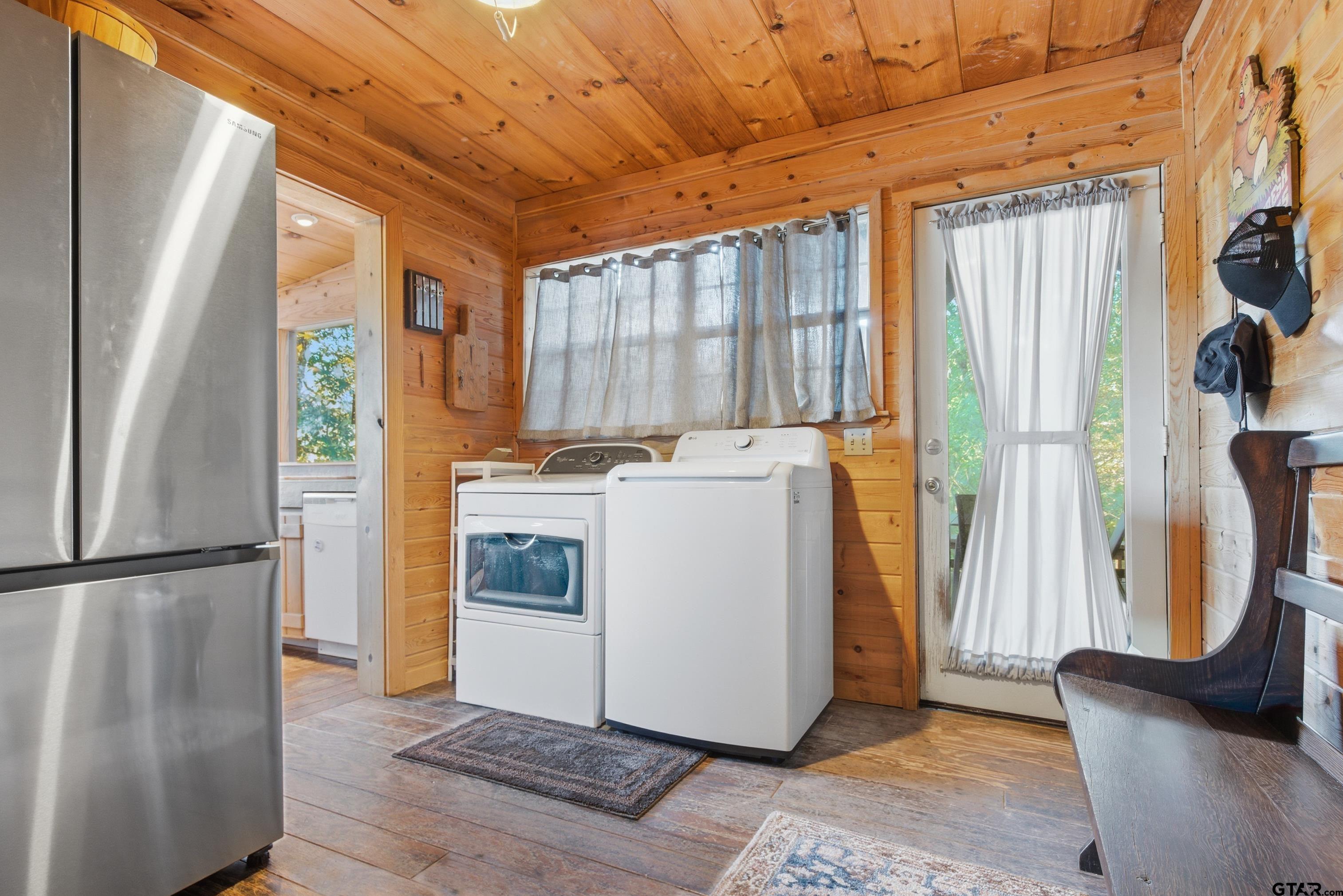 14525 Lake Road West Tyler, TX 75709 - Photo 29 of 30 a utility room with wooden floor and furniture