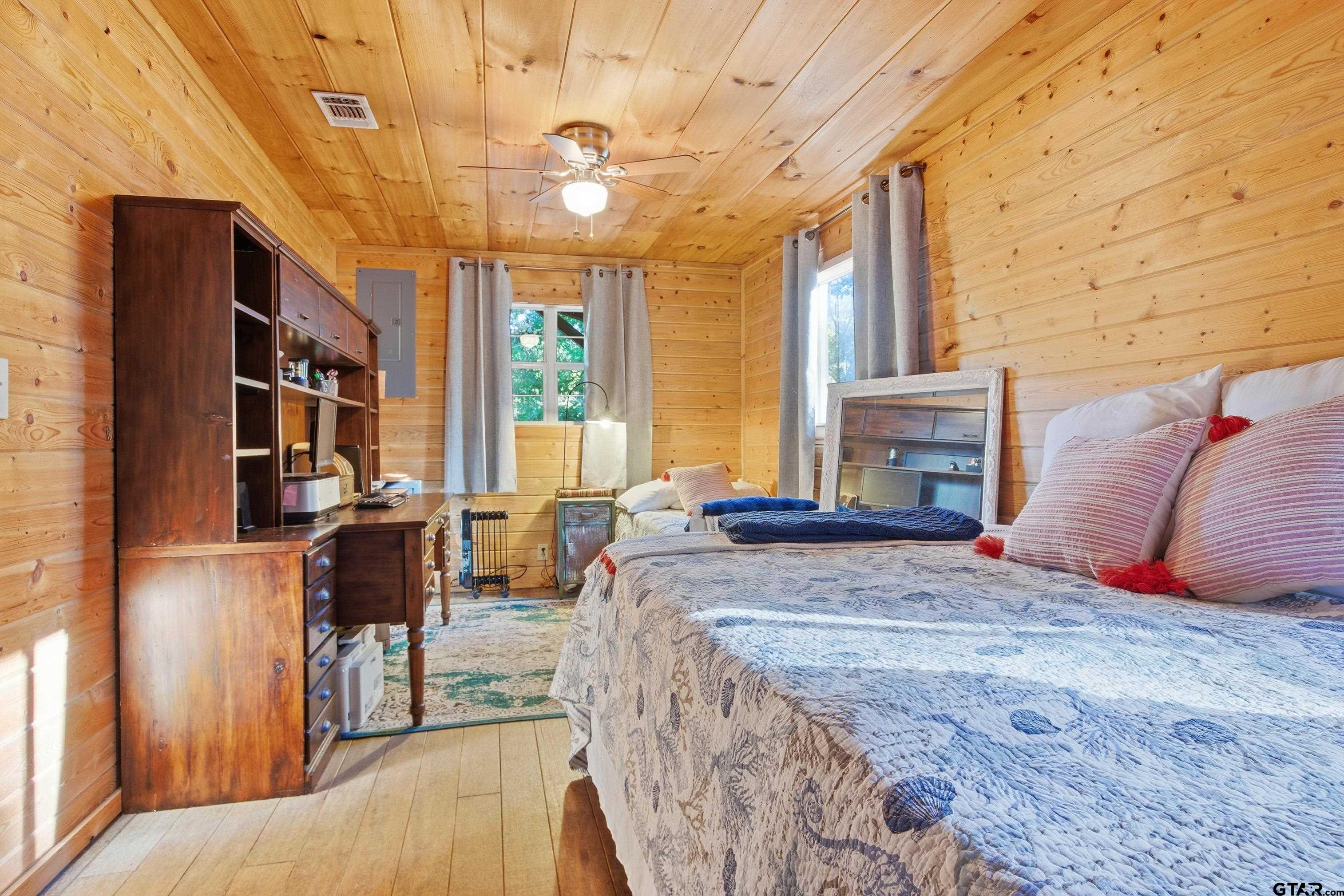 14525 Lake Road West Tyler, TX 75709 - Photo 30 of 30 a bedroom with furniture and a fireplace