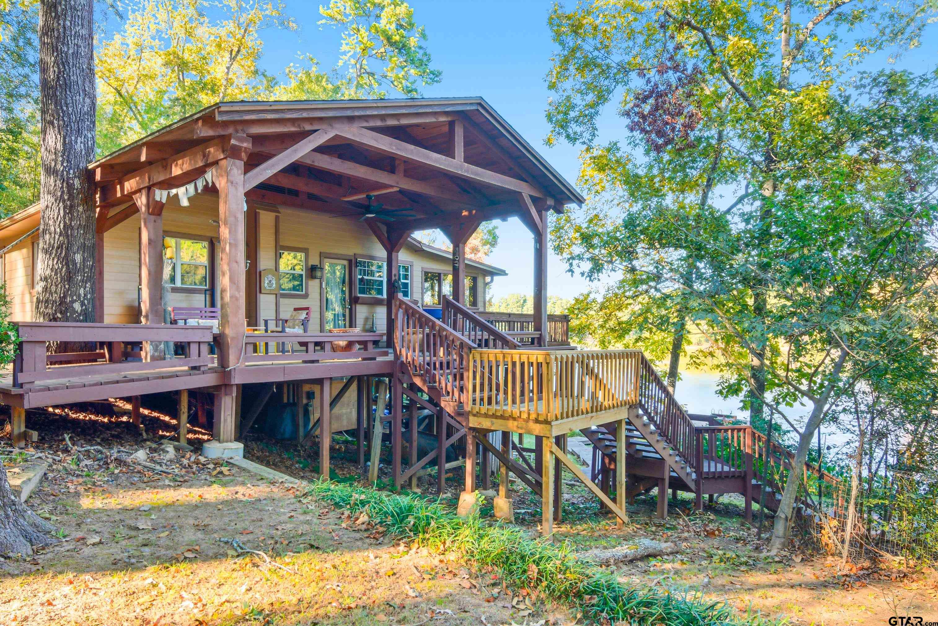 14525 Lake Road West Tyler, TX 75709 - Photo 3 of 30 a view of a chairs and table in backyard