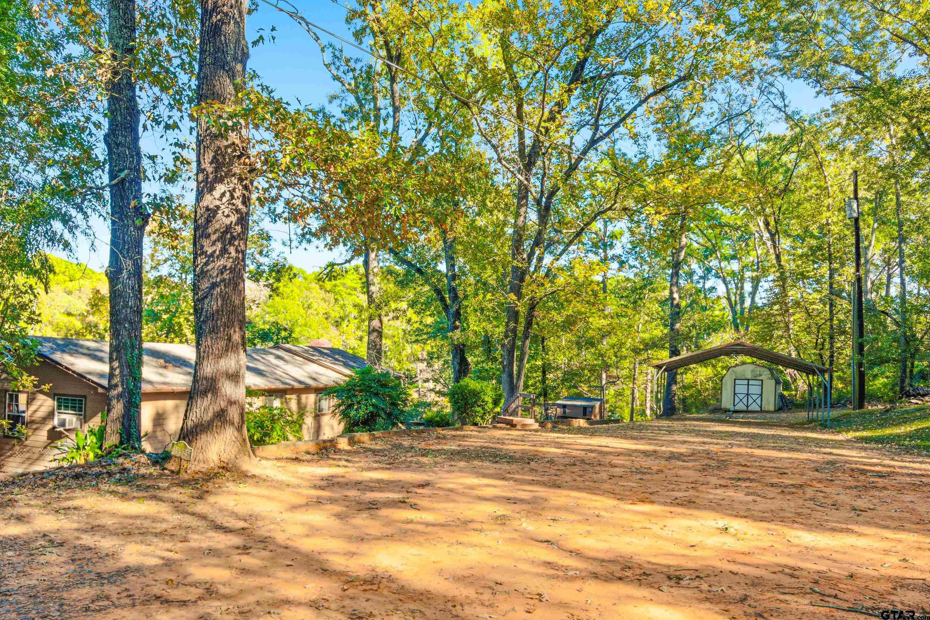 14525 Lake Road West Tyler, TX 75709 - Photo 6 of 30 a view of a house with a tree in the background