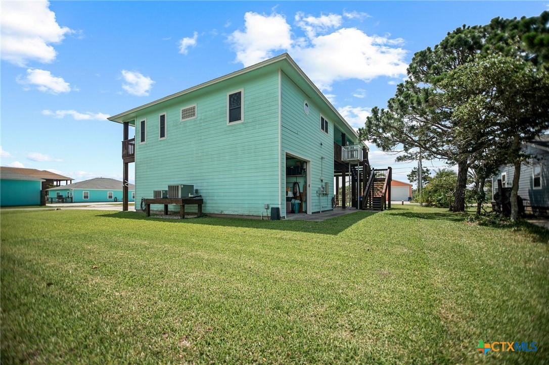 23 Macey Street Port O'Connor, TX 77982 - Photo 7 of 47 a front view of house with yard and trees