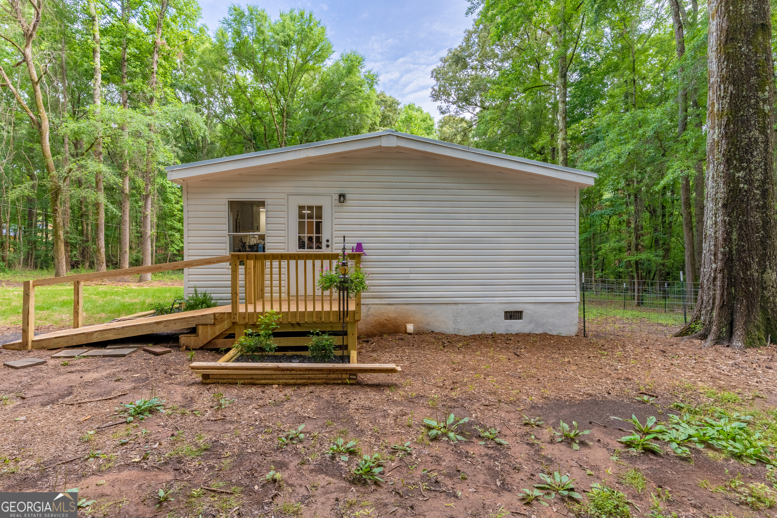 452 Aikenton Road Monticello, GA 31064 - Photo 38 of 47 a view of a house with a yard